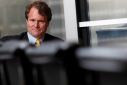 Bank of America Chief Executive Brian Moynihan looks on during an interview in Hong Kong