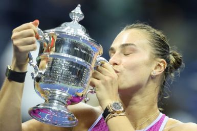 Champion: Aryna Sabalenka kisses the trophy after defeating Jessica Pegula in the US Open final