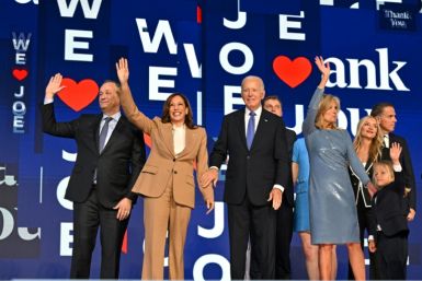 In an emotional speech, US President Joe Biden (C) chronicled the highlights of his time in the White House, heaping praise on his Vice President Kamala Harris