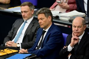 FDP Finance Minister Christian Lindner (L), Greens Economy Minister Robert Habeck (C) and Chancellor Olaf Scholz (R) of the SPD are locked in a budget dispute