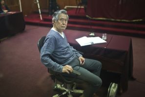 (FILES) Peru's former president (1990-2000), Alberto Fujimori, who faces trial appears in court for a hearing in Lima, on November 07, 2013. He died on Wednesday at the age of 86 in Lima