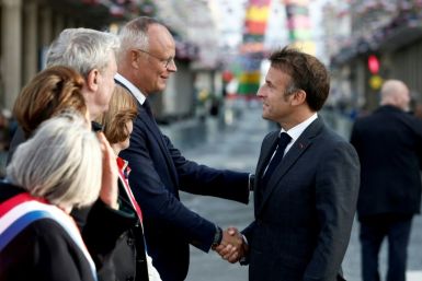 Former prime minister Edouard Philippe (C) had described President Emmanuel Macron's (R) move to call snap legislative elections as 'poorly thought out, poorly explained, poorly prepared'