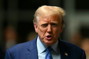Former US President Donald Trump speaks to the press at the end of the day of his trial for allegedly covering up hush money payments linked to extramarital affairs
