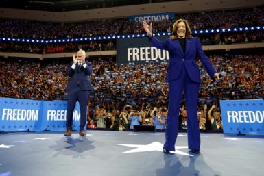 Kamala Harris and Tim Walz arrive to speak during a campaign rally in Milwaukee, Wisconsin, August 20, 2024