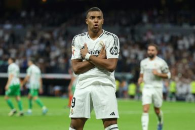 Kylian Mbappe celebrates scoring his team's second goal from the penalty spot during Liga match against Real Betis at the Santiago Bernabeu on Sunday