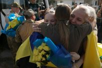 Members of the Azov brigade embraced after being released from Russian captivity