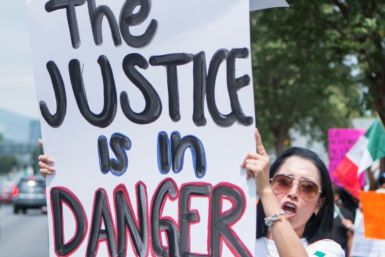 A Mexican judicial worker protests against controversial reforms proposed by outgoing President Andres Manuel Lopez Obrador