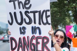 A Mexican judicial worker protests against controversial reforms proposed by outgoing President Andres Manuel Lopez Obrador