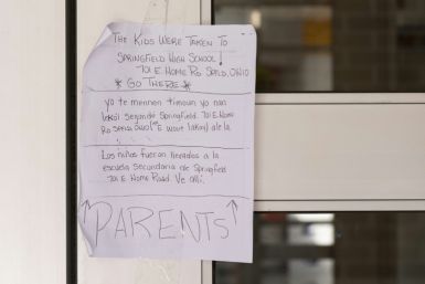 A note at an elementary school advised parents to go to another school nearby for pick up after the school was evacuated following bomb threats