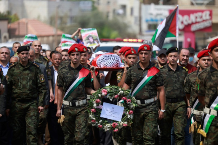 Palestinian security forces carry the body of slain US-Turkish activist Aysenur Ezgi Eygi in Nablus in the occupied West Bank
