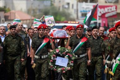 Palestinian security forces carry the body of slain US-Turkish activist Aysenur Ezgi Eygi in Nablus in the occupied West Bank