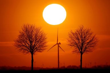 Power-generating windmill turbines are seen during sunset in Bourlon, France, February 23, 2021. 