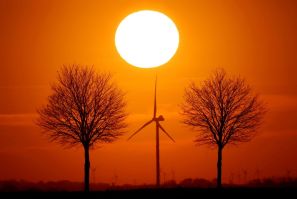 Power-generating windmill turbines are seen during sunset in Bourlon, France, February 23, 2021. 