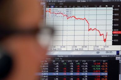 A sales manager looks at a screen which shows the decline in value of French CAC 40 stocks at Allianz Global Investors in Paris, France, August 24, 2015.  