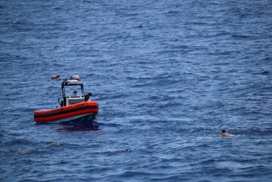 In this handout image courtesy of the US Coast Guard the Coast Guard Cutter Resolute small boat crew rescues 8 people from the water approximately 18 miles southwest of Key West, Florida, May 27,2021. The US Coast Guard said Sunday it had ended its search