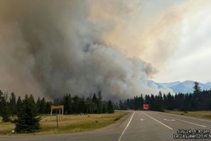 In this July 2024 image, smoke rises from a wildfire burning in Jasper National Park in Canada. The wildfire devoured up to half of the main town