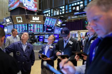 Traders work on the trading floor at the New York Stock Exchange (NYSE) in Manhattan, New York City