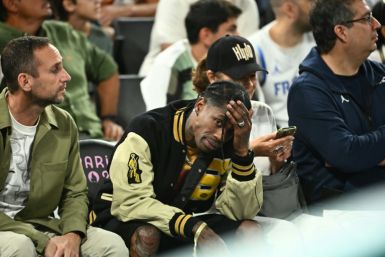 Travis Scott was seen attending the Olympics men's basketball semi-finals on Thursday evening