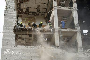 Ukrainian rescuers working in a military educational facility which was hit by missiles in Poltava, eastern Ukraine on September 3, 2024