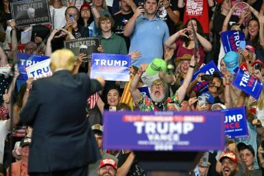 US President Donald Trump gestures at the crowd in Grand Rapids, Michigan, where he made a triumphant return to the campaign trail Saturday