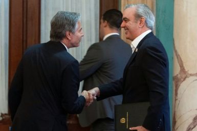 US Secretary of State Antony Blinken shakes hands with President of the Dominican Republic Luis Abinader after a joint news conference at the National Palace in Santo Domingo