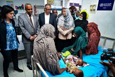 WHO chief Tedros Adhanom Ghebreyesus (C) visited a children's hospital in Port Sudan